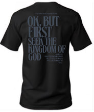 Load image into Gallery viewer, Black t-shirt with text on the back on a white background
